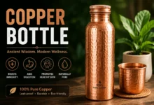 Copper bottle with water, lemon, mint, and natural wellness ingredients