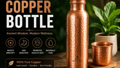 Copper bottle with water, lemon, mint, and natural wellness ingredients